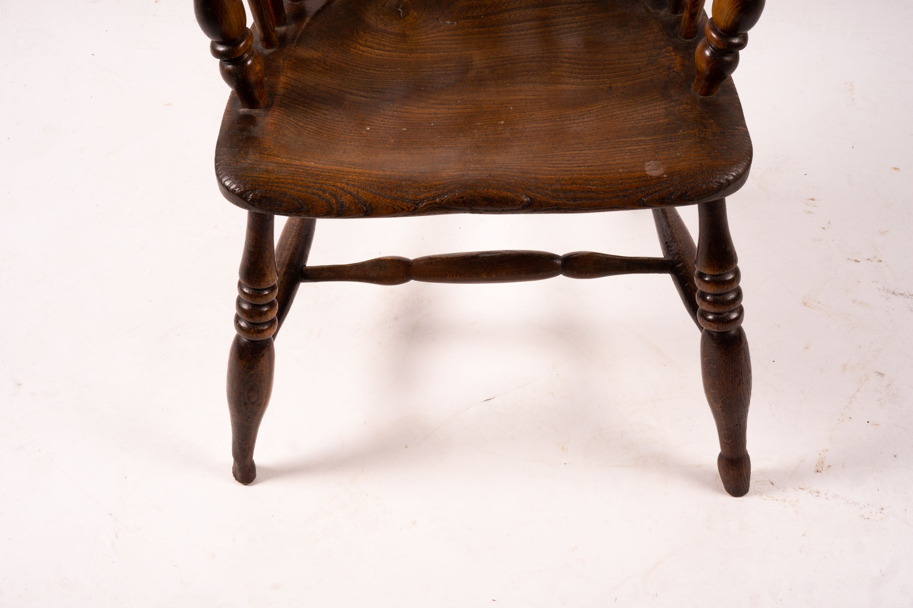 An early 19th century ash, elm and fruitwood Derbyshire area Windsor armchair with 'H' stretcher, width 56cm, depth 44cm, height 106cm